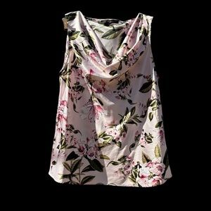Beautiful soft and silky women’s scooped neck sleeveless shirt in flower pattern